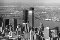 Нью-Йорк - The World Trade Center, shown under construction in 1970, and other modern skyscrapers eventually dwarfed the Woolworth Building, visible here at the center США,  Нью-Йорк (штат),  Нью-Йорк,  Манхеттен